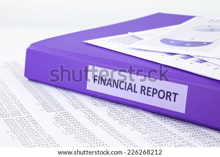 Purple binder of financial report place on sale and purchase statement, concept to financial accounting