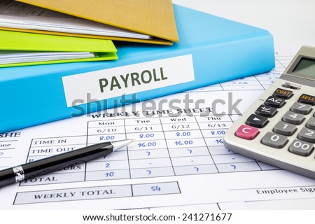 PAYROLL word on blue binder place on weekly time sheet and payroll summary report, human resources concept