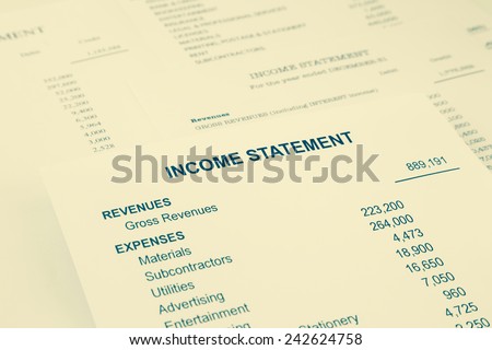Income statement reports with detail list of revenues and expenses for business and financial concept, sepia tone image