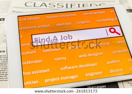 Orange tablet screen fill with career words. Internet website for online job search having wording \