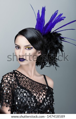 beautiful girl with a feather in his head
