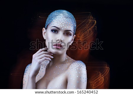 beautiful woman with rhinestones on her head surrounded by his soul.