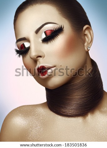 woman with closed eyes and bright makeup