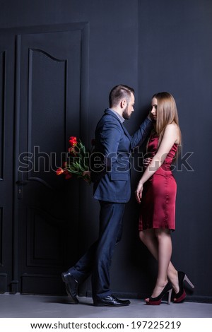 man and woman in a dark room, love or separation