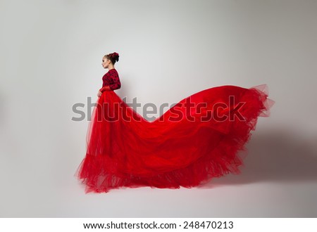 on a white background woman in a long red dress