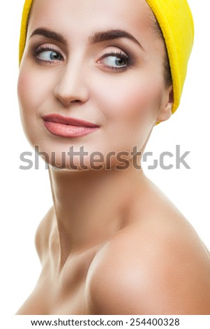 beautiful and well-groomed girl with a yellow bandana on his head, shining healthy skin
