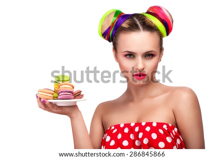 beautiful girl with bright hair and biscuits in the hands of the French