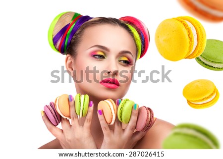 beautiful girl with bright hair and biscuits in the hands of the French