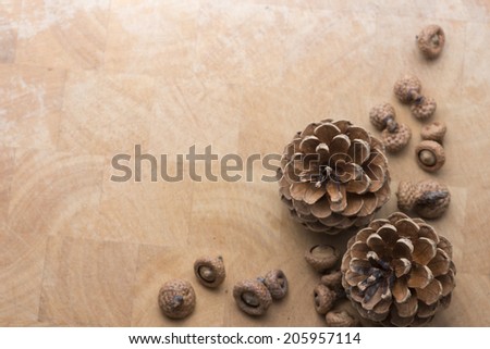 the pine nuts on wooden table as background with copy space