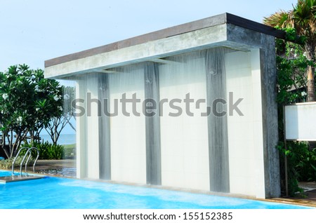 smooth water fall partition at the swimming pool with long shutter opening technicque