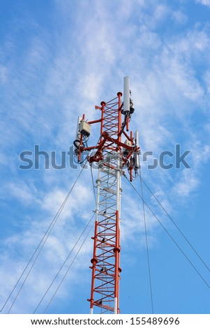 Antenna repeater tower on blue sky and white cloud