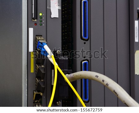 Fiber Optics with SC/MU connectors. Internet Service Provider equipment. Focus on fiber optic cables. Data Network Hardware Concept.