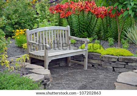 Wooden bench in lily flower garden