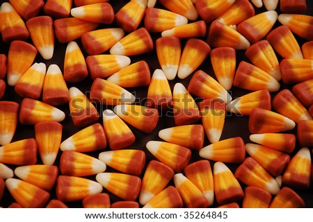 Candy corn on black background