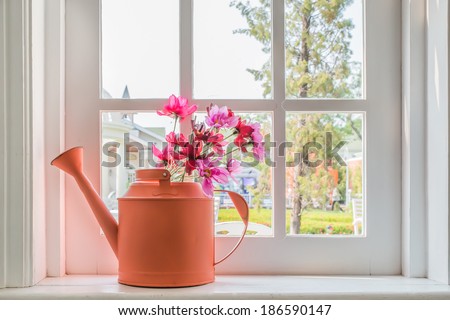 Pot with a flower on the windowsill country house