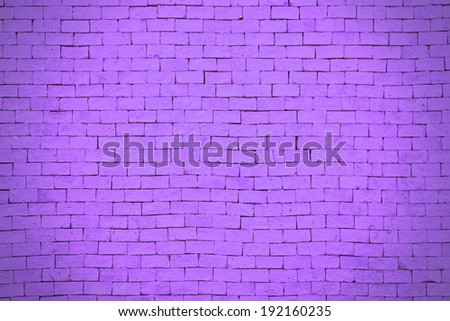Background of purple brick wall pattern texture.