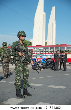 BANGKOK - May 23 :Thai Army officer with rifles patrol around Bangkok after Thai Royal Army coup d\'etat government on May 23,2014 in Bangkok, Thailand.