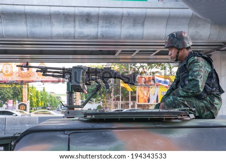 BANGKOK - May 23 :Thai Army officer with rifles patrol around Bangkok after Thai Royal Army coup d'etat government on May 23,2014 in Bangkok, Thailand.