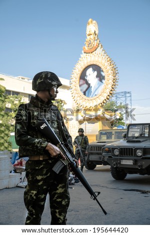 BANGKOK - May 23 :Thai Army officer with rifles patrol around Bangkok after Thai Royal Army coup d\'etat government on May 23,2014 in Bangkok, Thailand.