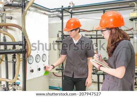 Chemical engineer open  valve equipment in a boiler house