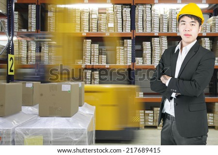 Manager asian business in modern warehouse