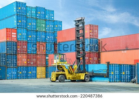 Crane lifter handling container box loading to depot