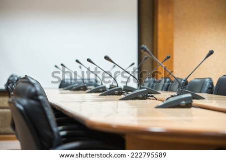 before a conference, the microphones in front of empty chairs.Selective focus.