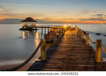 Landscape of Wooded bridge pier between sunset. Summer travel in Phuket ,Thailand.