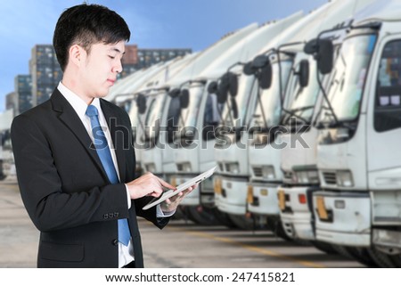 Business man using tablet to handle export and import Container transport