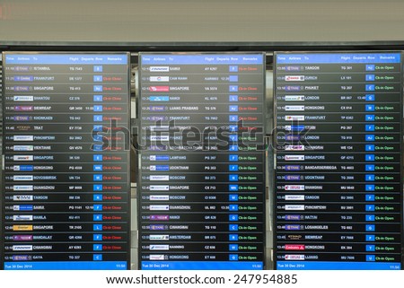 BANGKOK - Dec 30 : The display board in an airport with departure and arrival times on Dec 30,2014 in Bangkok, Thailand.