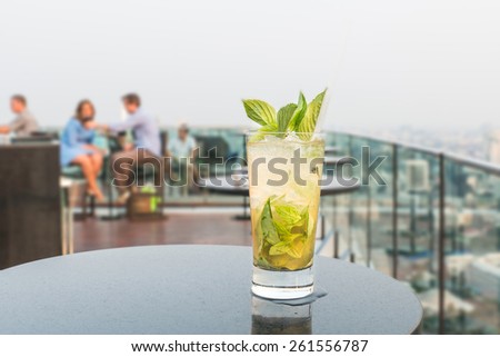 Mojito cocktail on table in rooftop bar