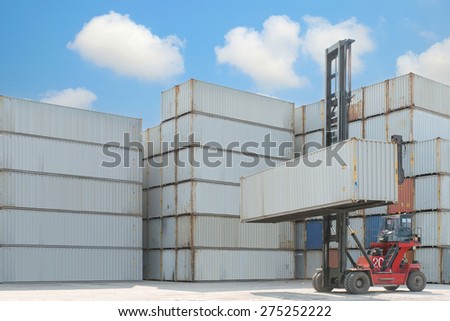 Crane lifter handling container box loading to depot Crane lifter handling container box loading to depot