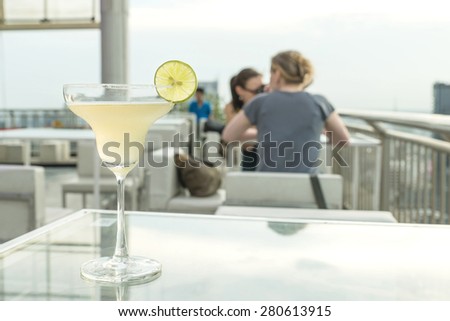 Margarita cocktail on table in rooftop bar