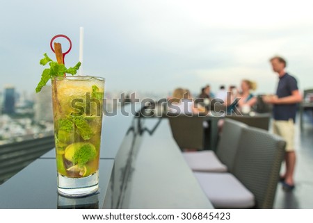 Mojito cocktail on table in rooftop bar