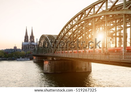 Cologne, Germany. Image of Cologne with Cologne Cathedral and railway during sunset in Germany.
