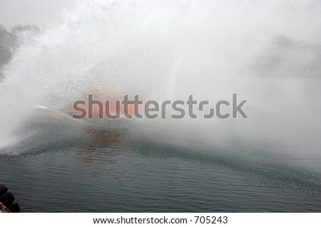 Diving lifeboat making a big splash as it hits the ocean surface