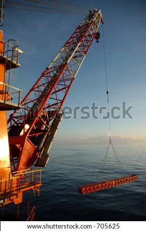 Offshore crane lifting a 13 meter basket