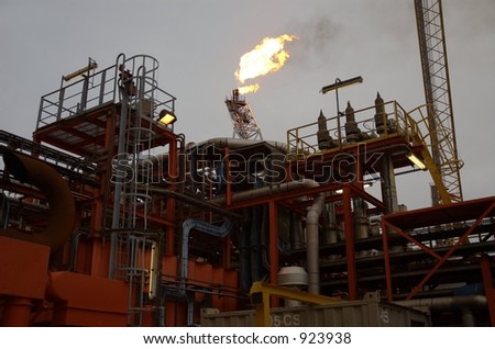 Flare boom behind production facilities on offshore oil rig