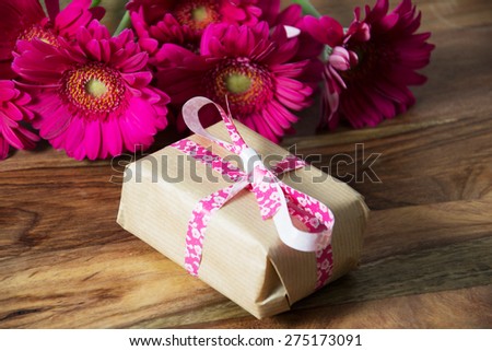 Pink flowers and present