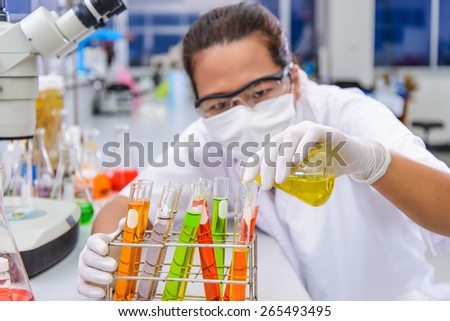 Scientist test dosage drop tube in the laboratory
