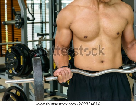 Man with weight training equipment
