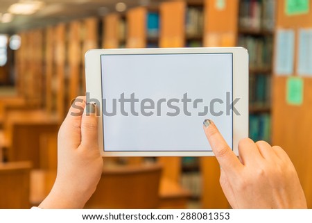 Hands hold info online researching knowledge  in library