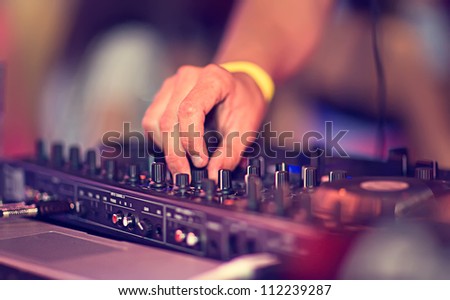 Dj mixing in night club