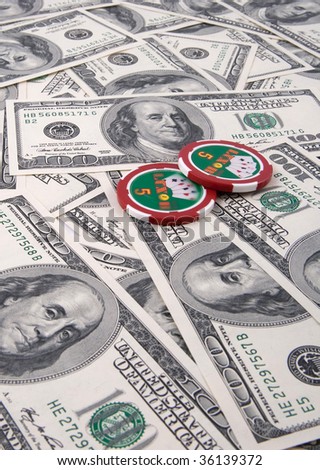 Poker chips and money on money background