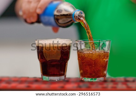 Carbonated drink poured into a glass.