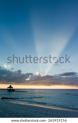 A new day starts as sun rises above the sea, Maldives