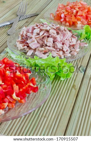 diced ham and vegetables in the dishes on the table
