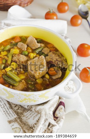 beef stew with different vegetables in ceramic ware