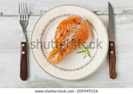 salmon fillet on a plate on the table.selective focus. health and diet concept