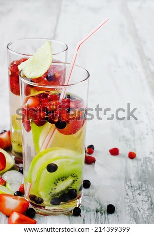 summer cool drink with fresh berries and fruit on the old wooden background. health and diet food. copy space background